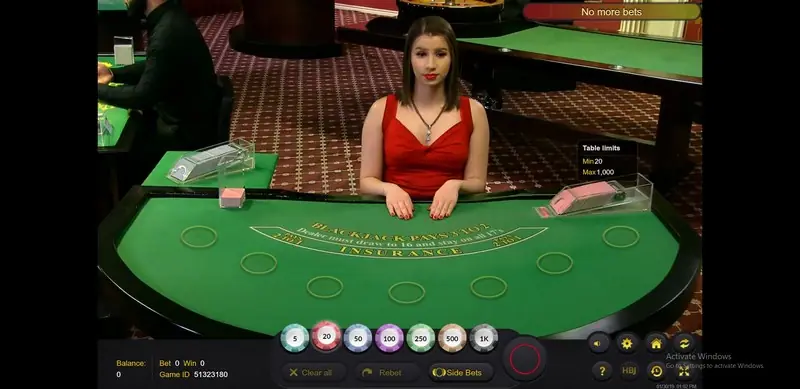 Ezugi blackjack dealer dealing opening cards to each seat