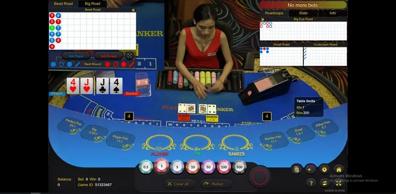 Ezugi Queenco table with the live dealer and players' bets on screen